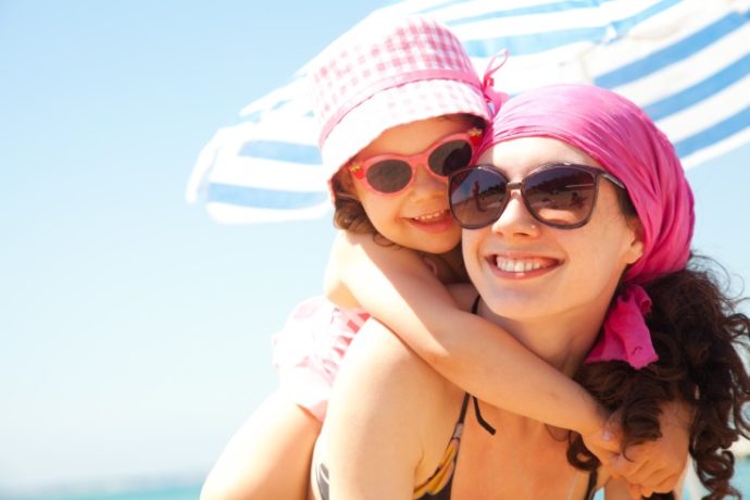 little girl and her mother have a good time at the seaside resort