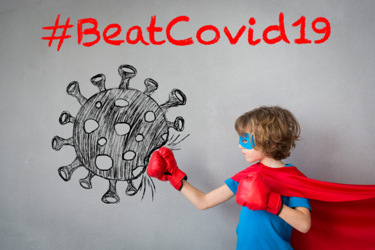 Superhero child beat COVID-19. Super hero kid punching on the drawn coronavirus. Winner and success concept