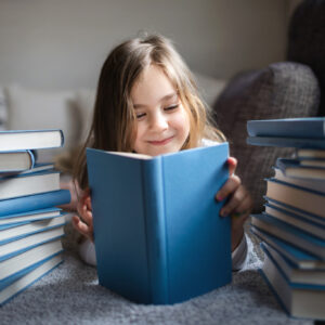 Cute Little girl reading book